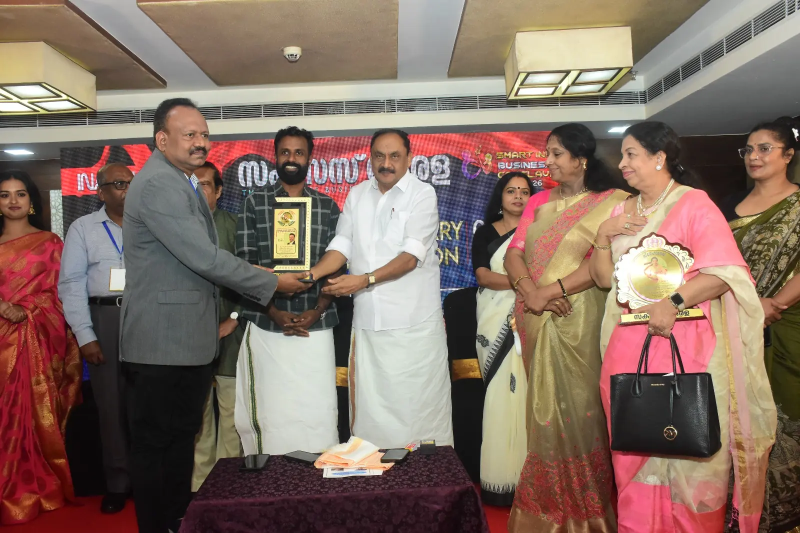 Dr. Vijayakumar receiving the Excellence Award for Best Ayurveda Hospital of the Year 2026